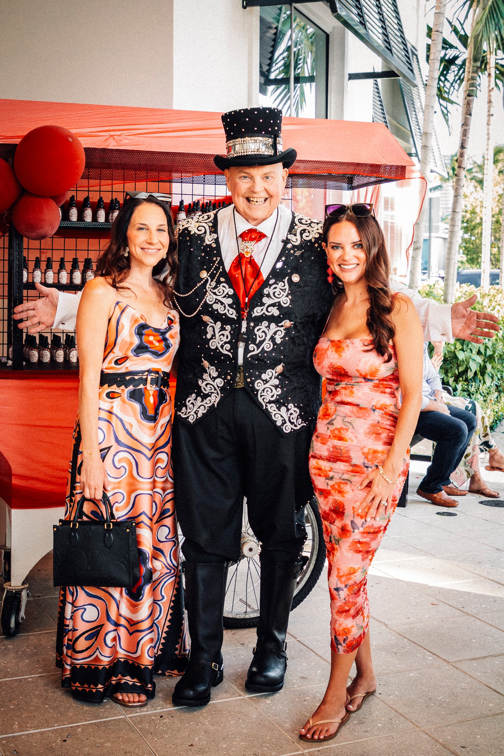 Ringmaster posing with guests outdoors