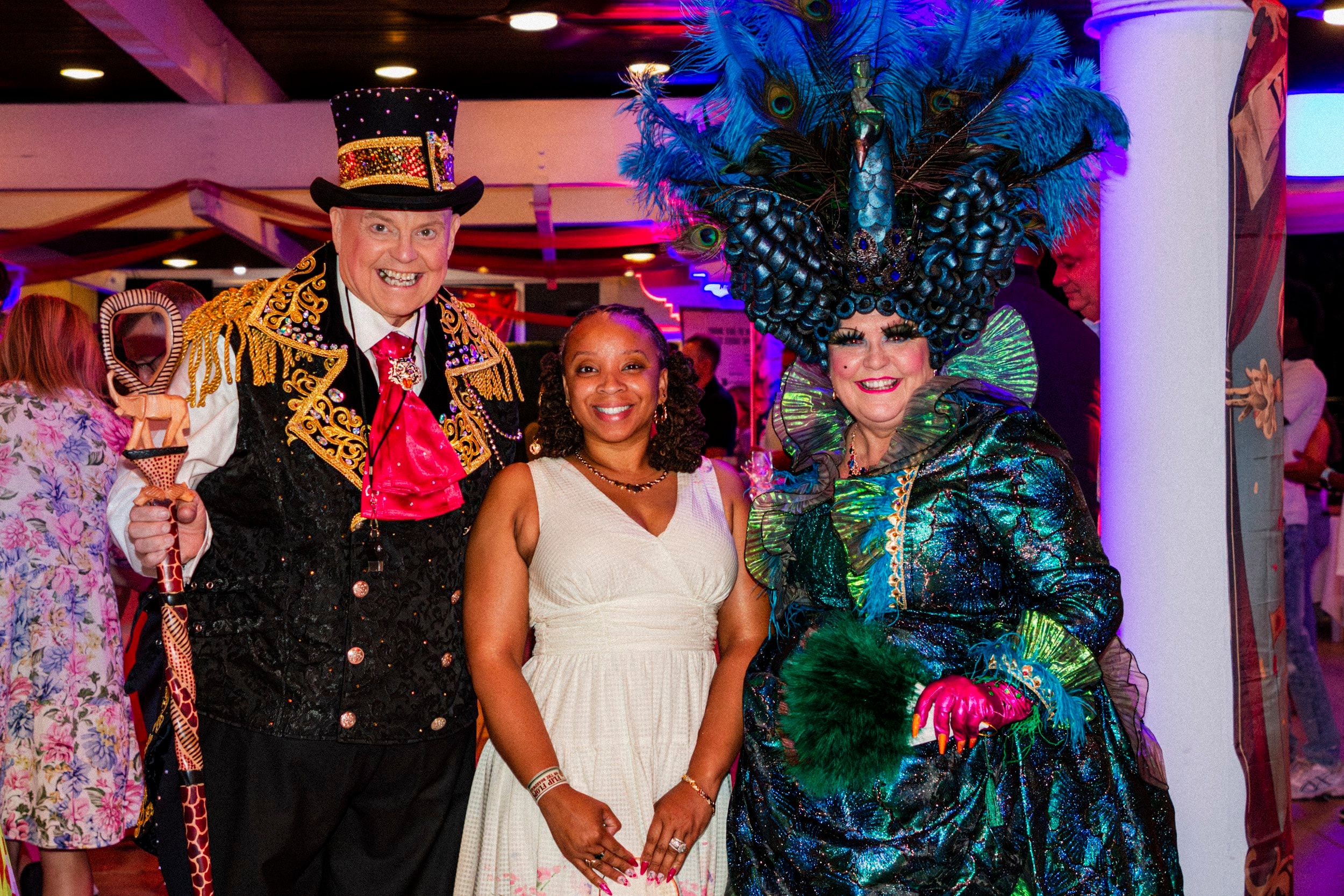 Costumed performers posing at Mardi Gras party