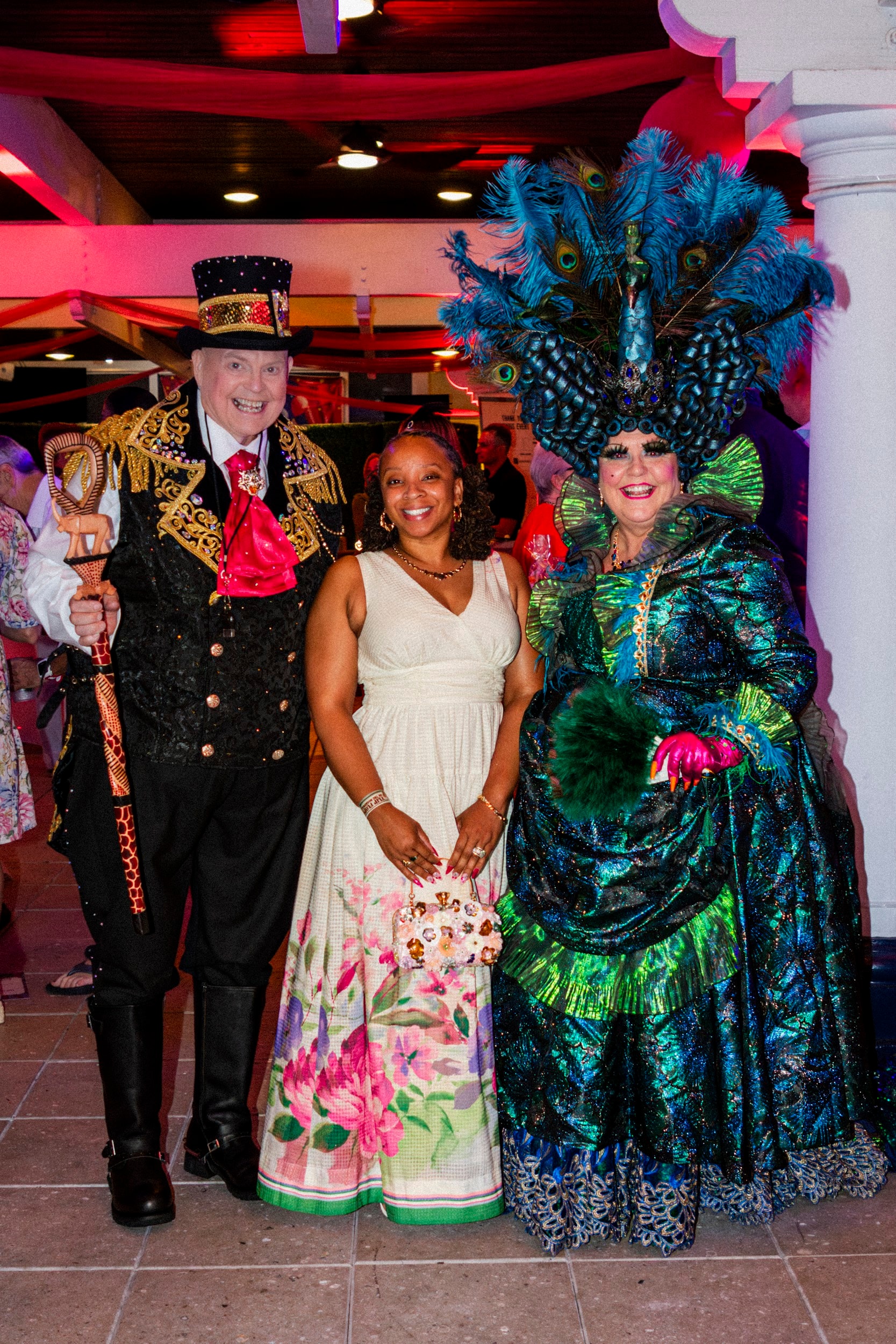 Three people in elaborate carnival costumes